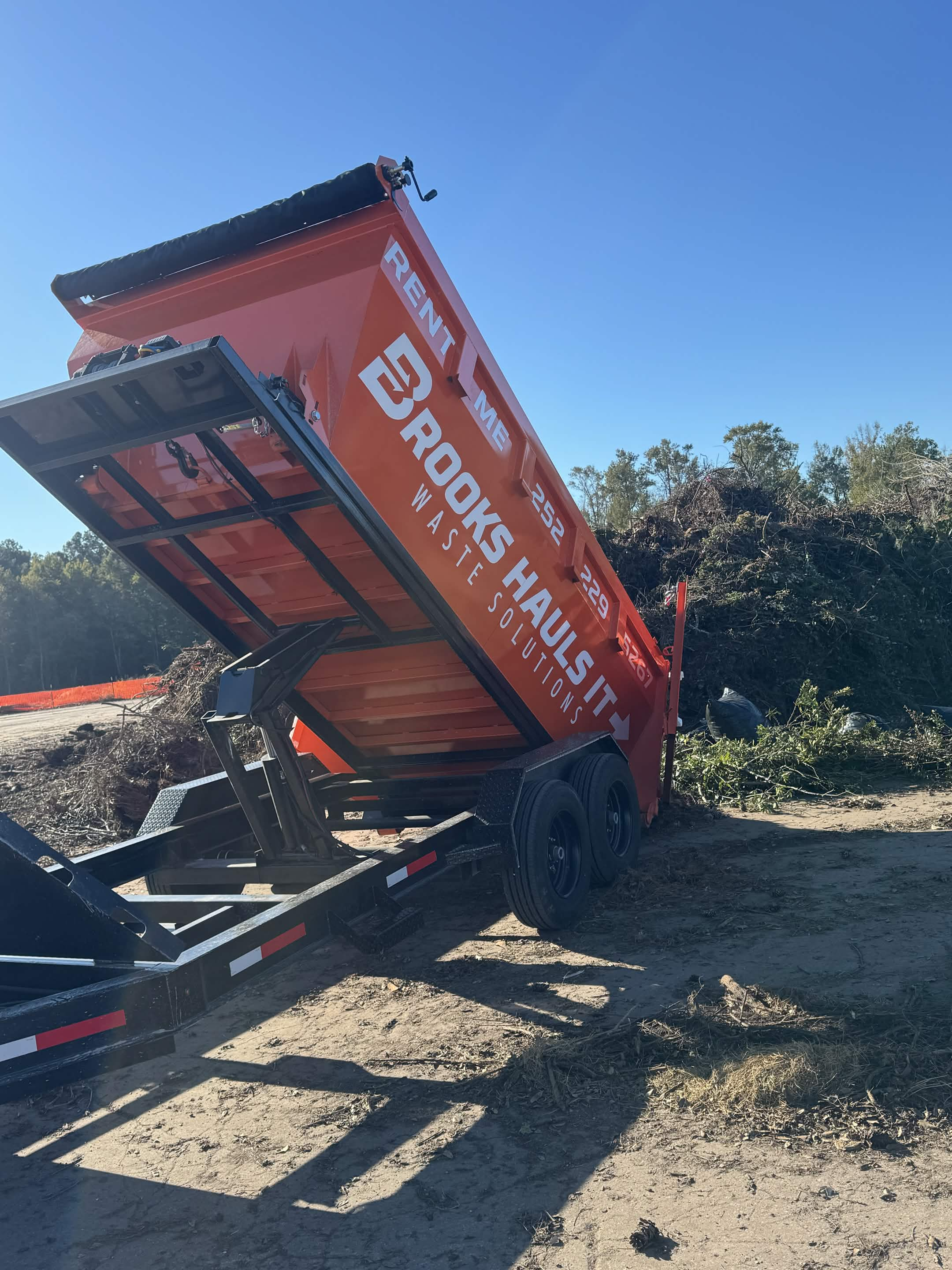 Brooks Hauls It orange 15-yard dumpster